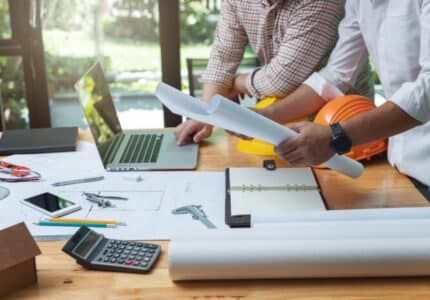 Engineer and Architect concept, Engineer Architects and real estate agent office team working with blueprints